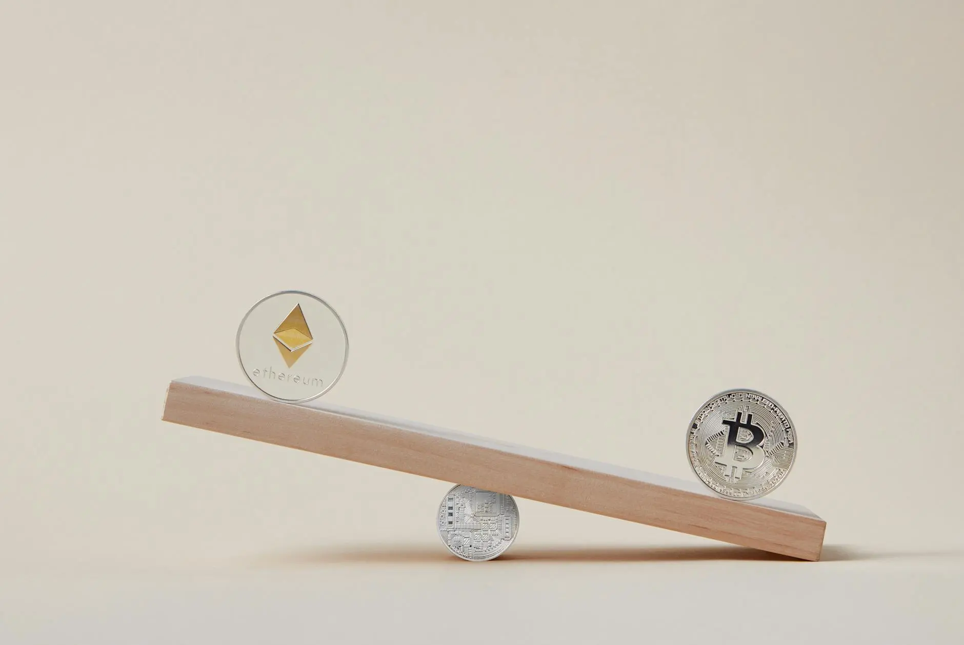 A wooden plank balancing Ethereum and Bitcoin coins, symbolizing cryptocurrency market dynamics.