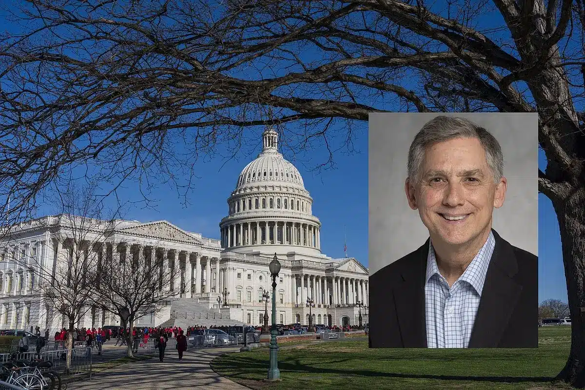 The U.S. Capitol building with a smiling congressman's portrait inset.
