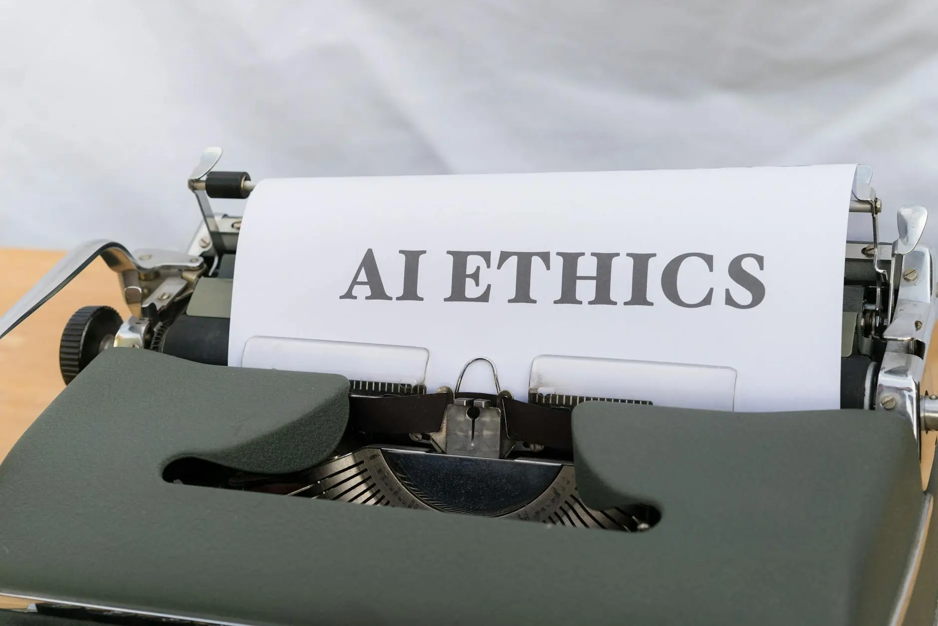 A close-up of a typewriter with a page printed 'AI ETHICS'.