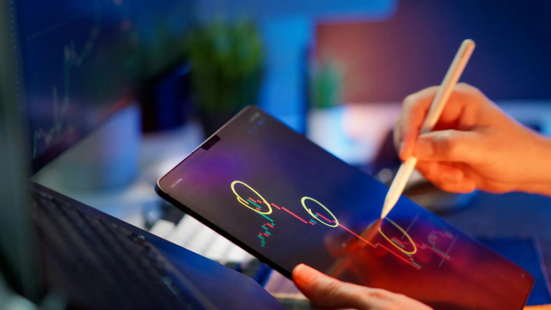A person using a stylus on a tablet displaying cryptocurrency charts.