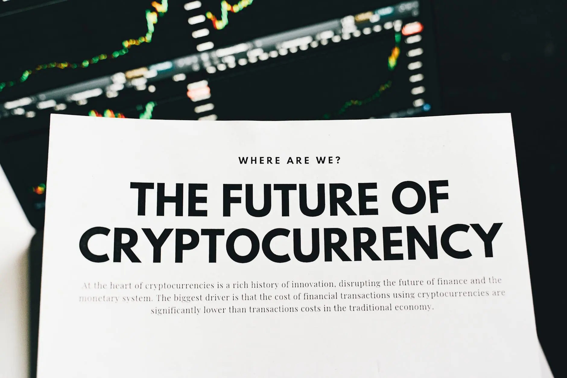 A printed page titled 'The Future of Cryptocurrency' with graphs in the background.