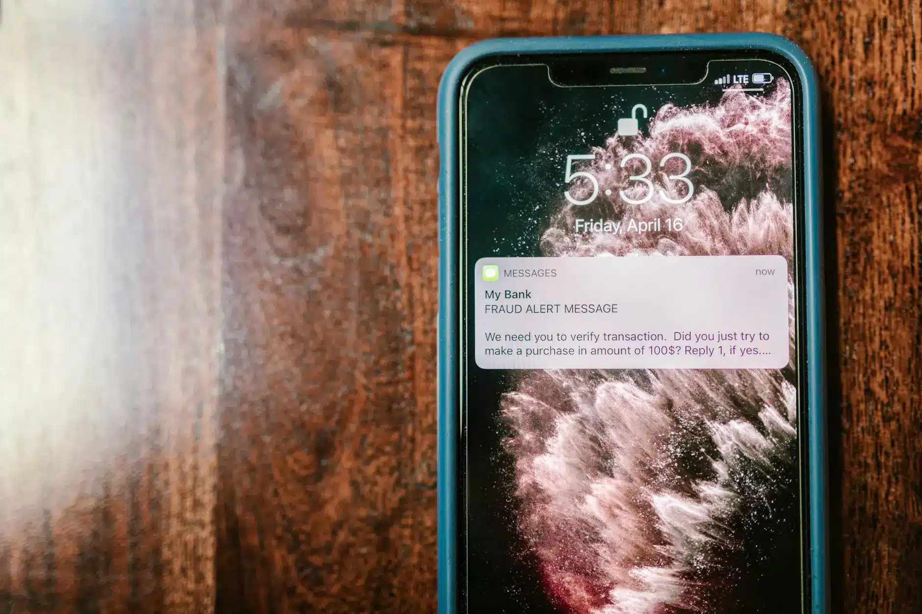 Smartphone screen displaying a fraud alert message from a bank.