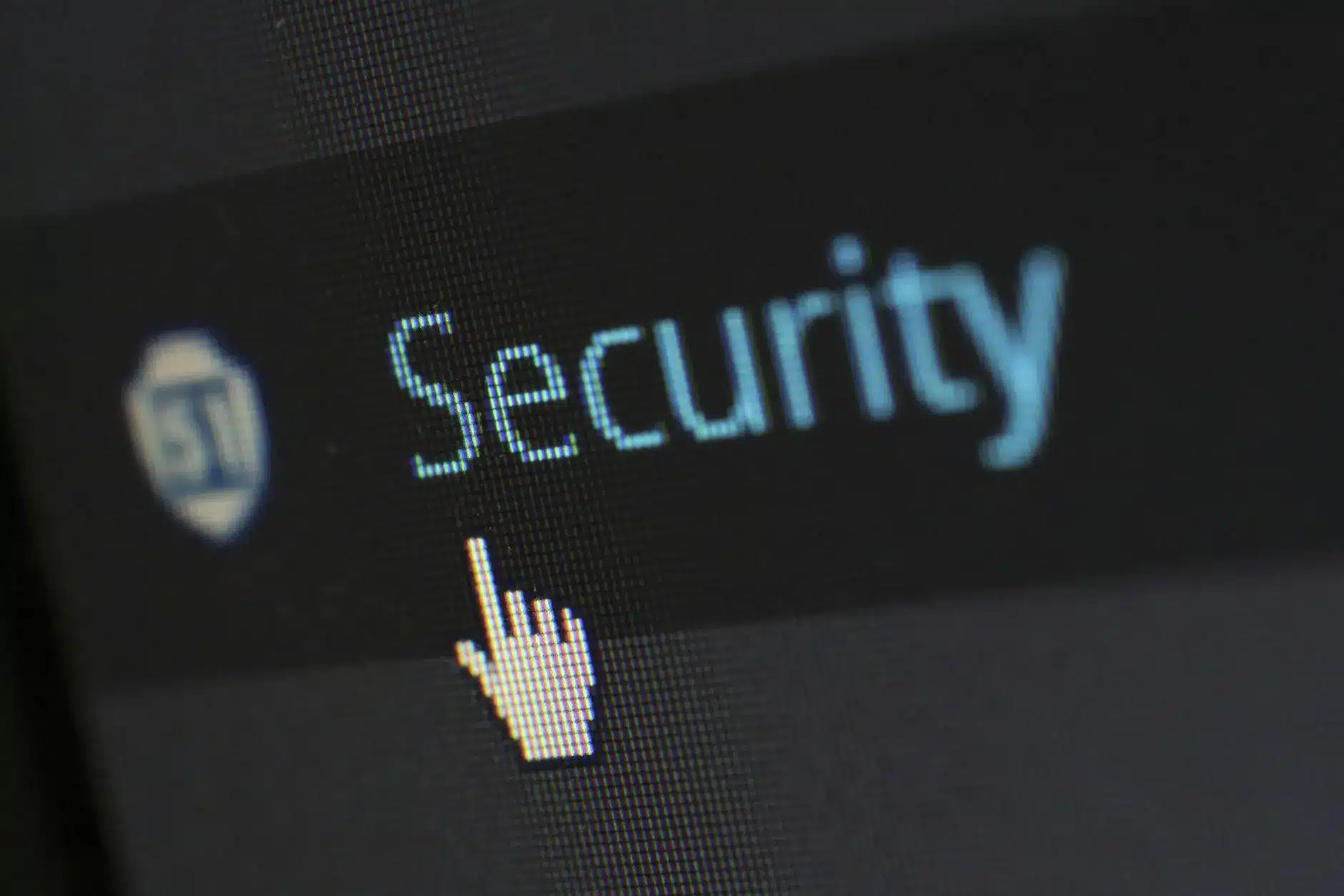 Close-up of a computer screen displaying the word 'Security' with a cursor hovering.
