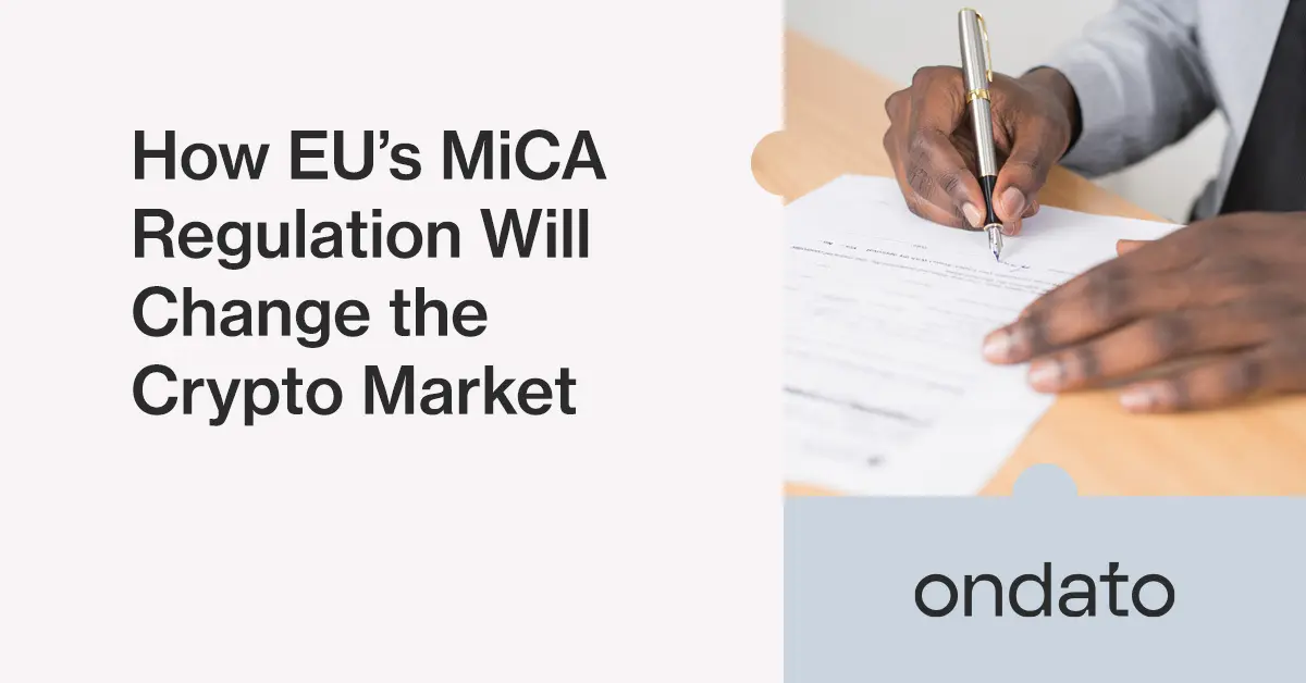 Person signing a document with a pen, representing regulatory processes.