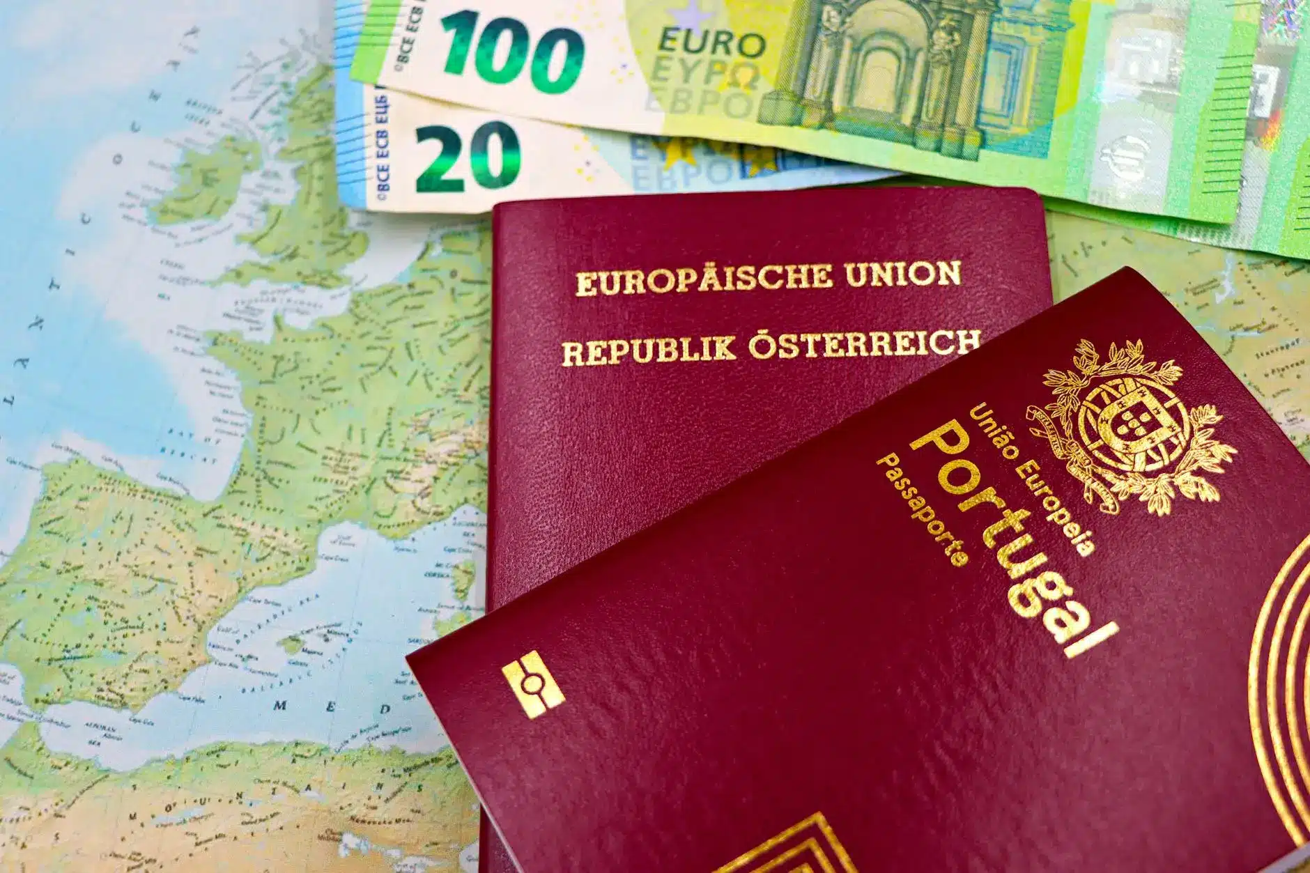 Euros and EU passports on a map, symbolizing European regulations.