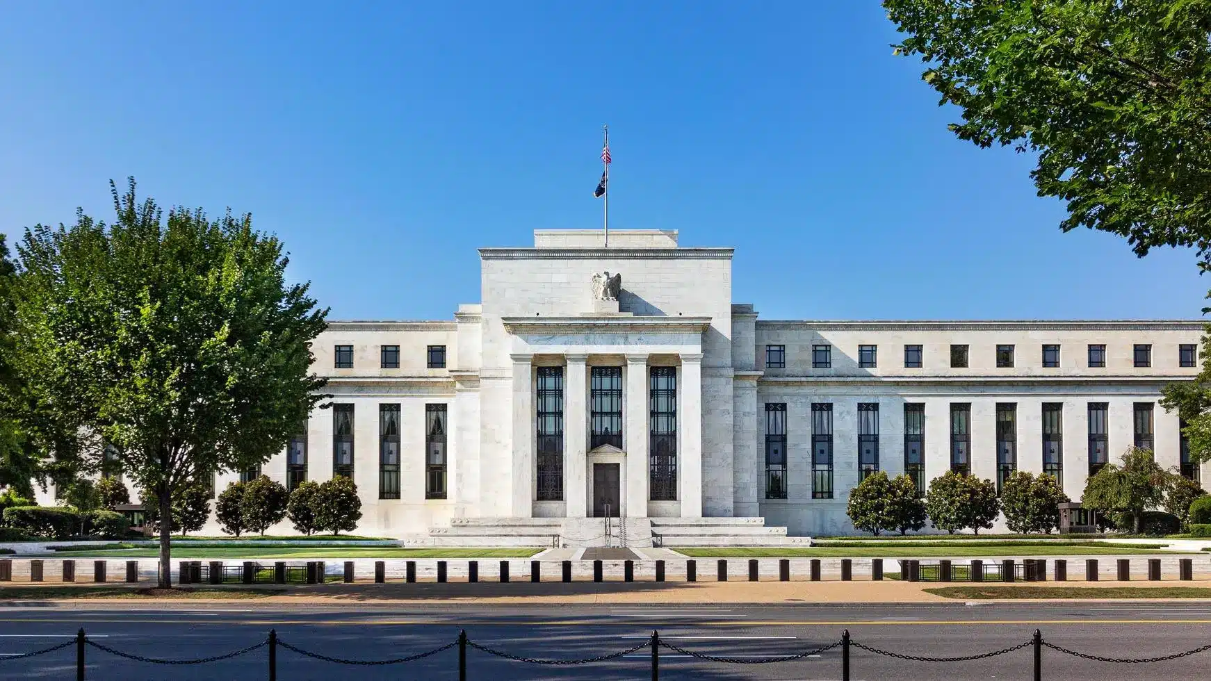 Federal Reserve building in Washington D.C. with clear blue sky.