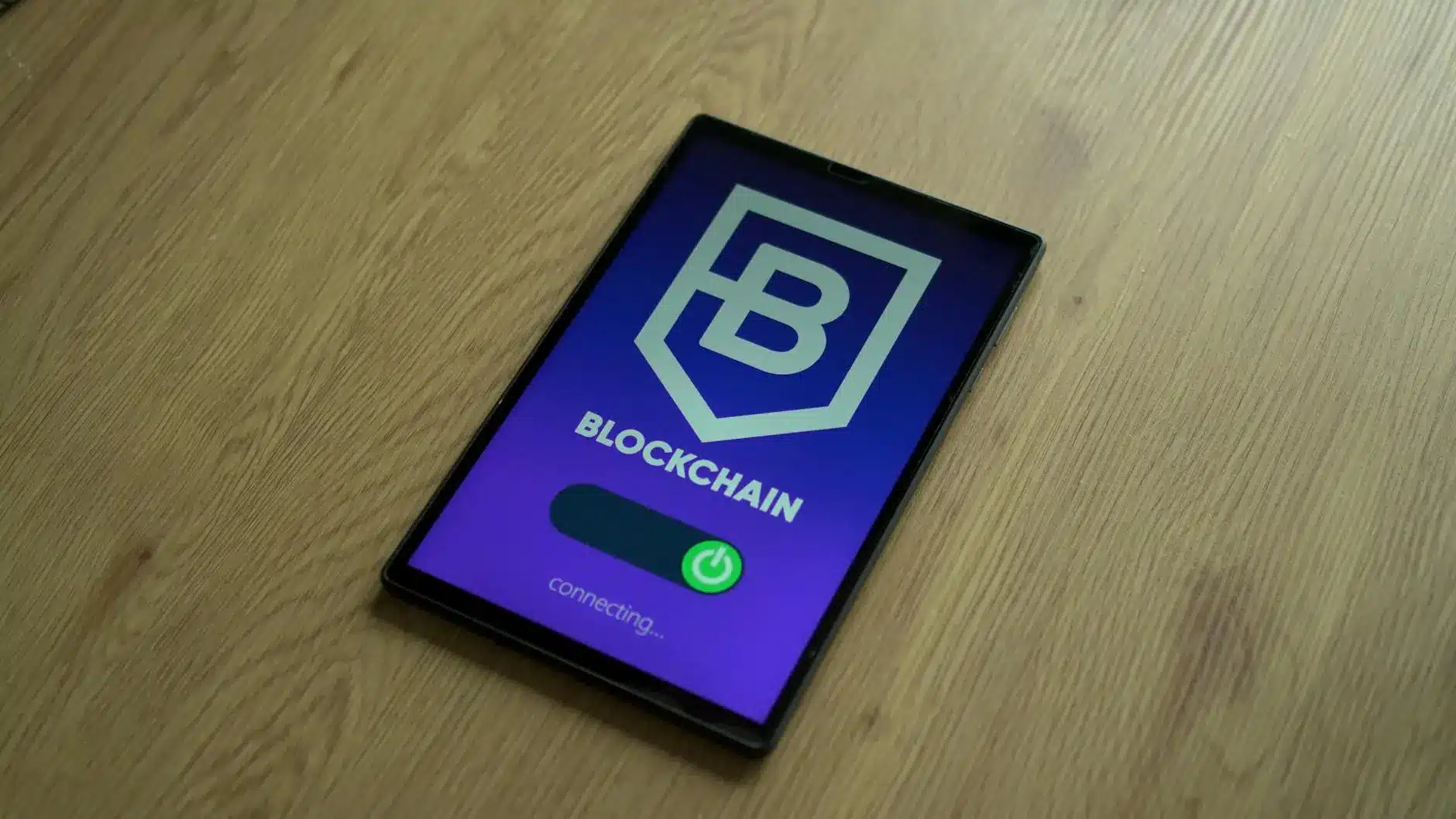 Tablet displaying a blockchain interface with a connecting status.