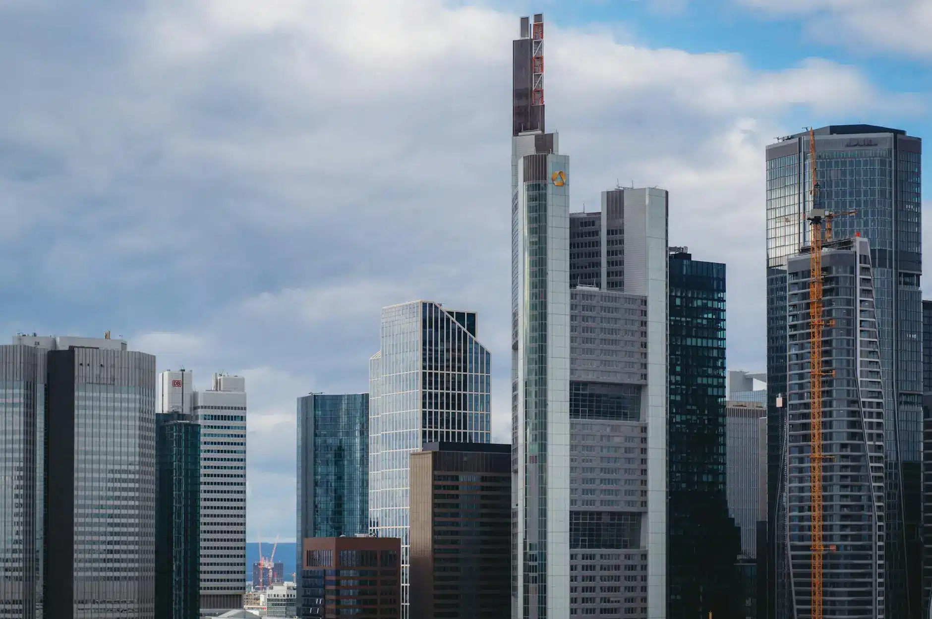 A skyline view of modern skyscrapers with diverse architectural styles.