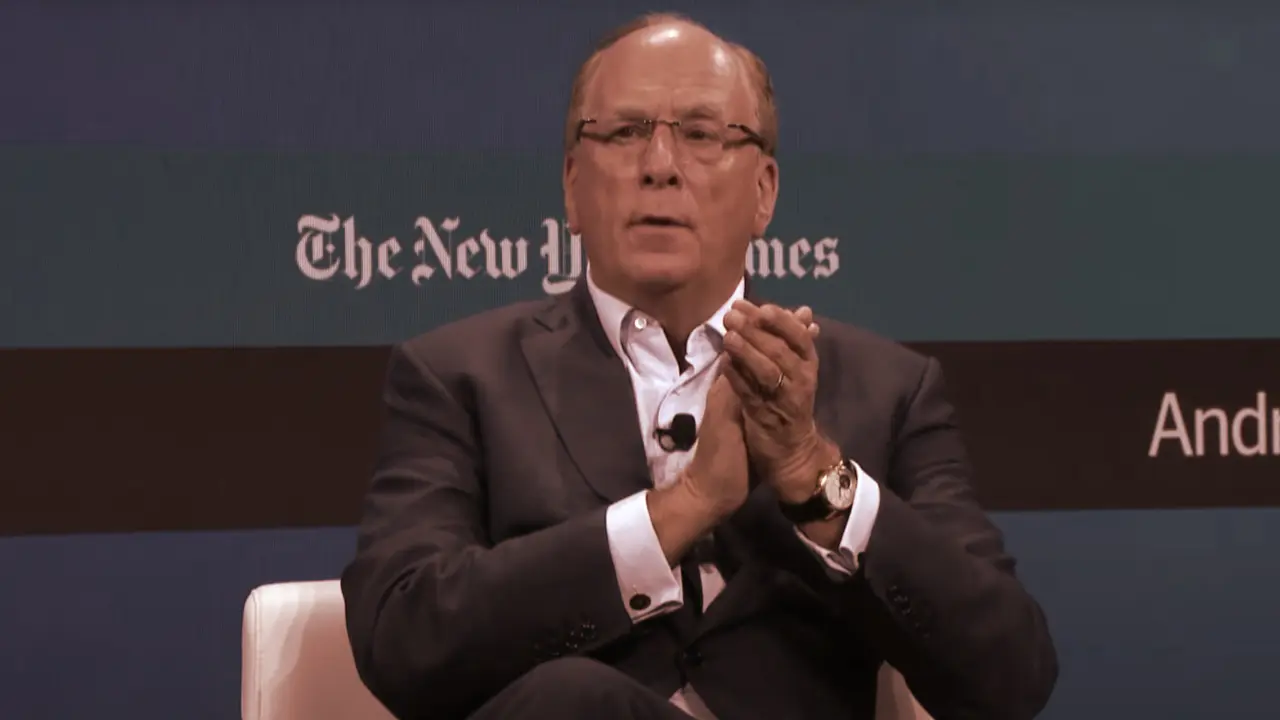 Larry Fink, CEO of BlackRock, seated and speaking at an event.