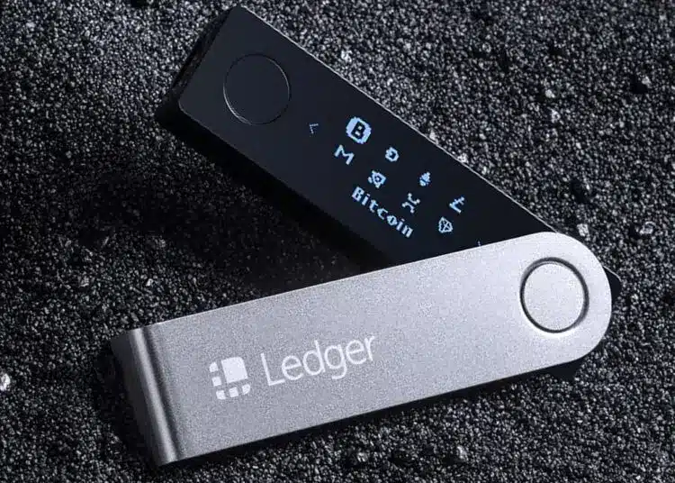Ledger Nano hardware wallet displayed on a textured dark surface.