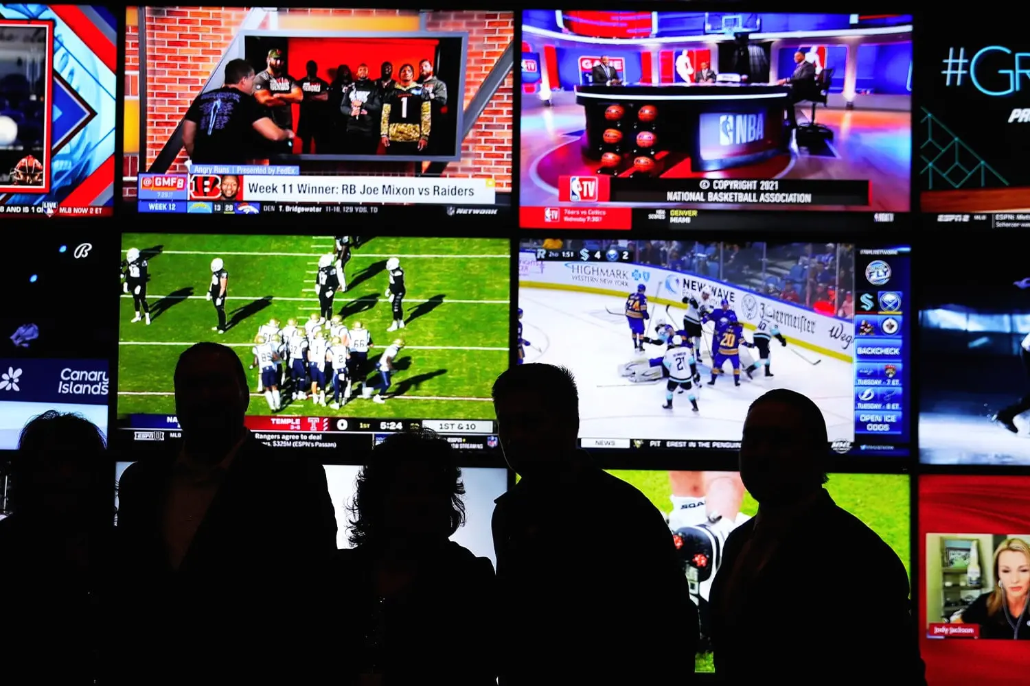 A sports betting interface displaying multiple game broadcasts and betting information.