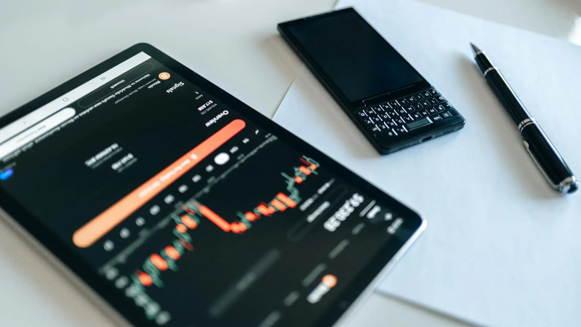 A tablet displaying a crypto trading dashboard with charts and data.