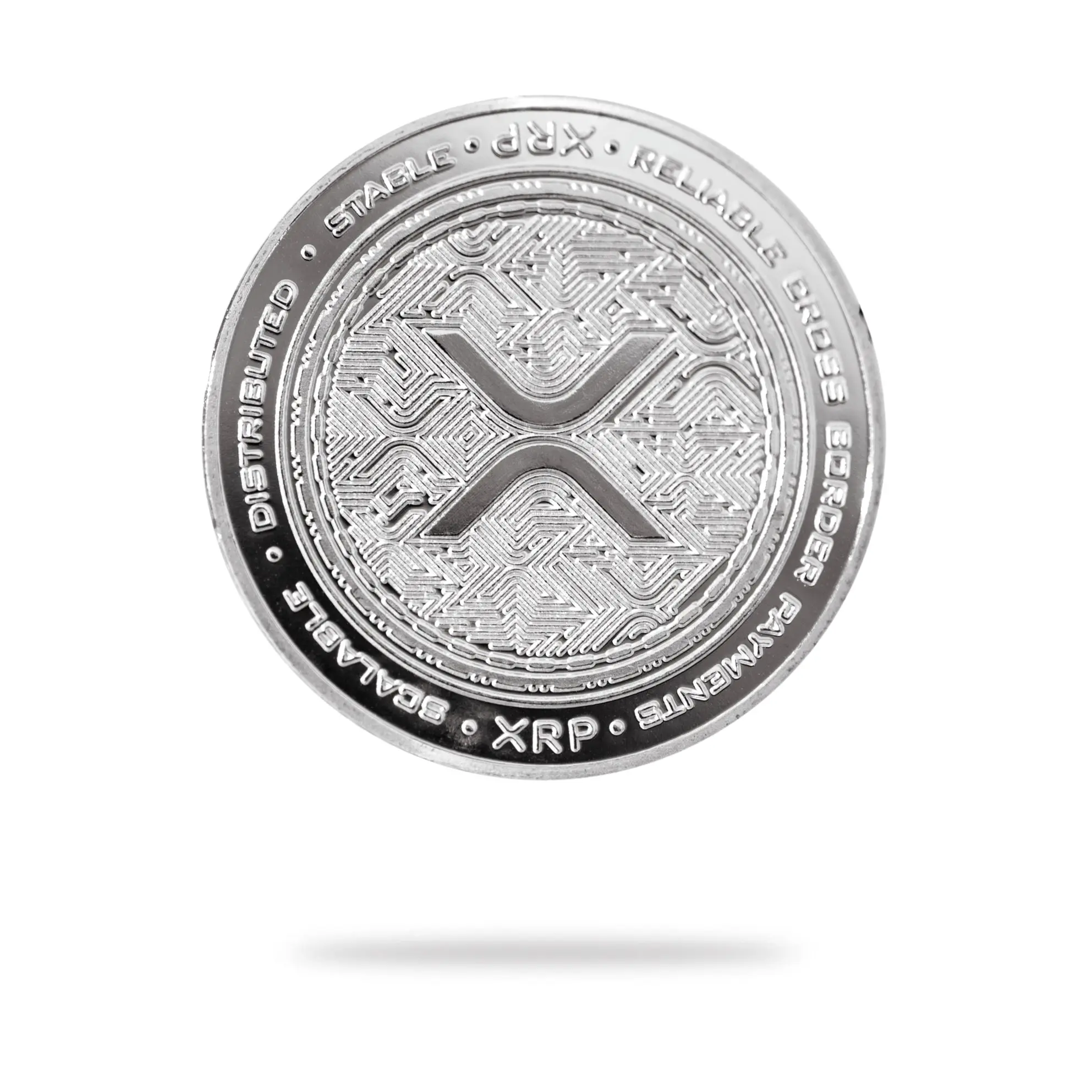Physical XRP coin featuring the Ripple logo and text detailing attributes.