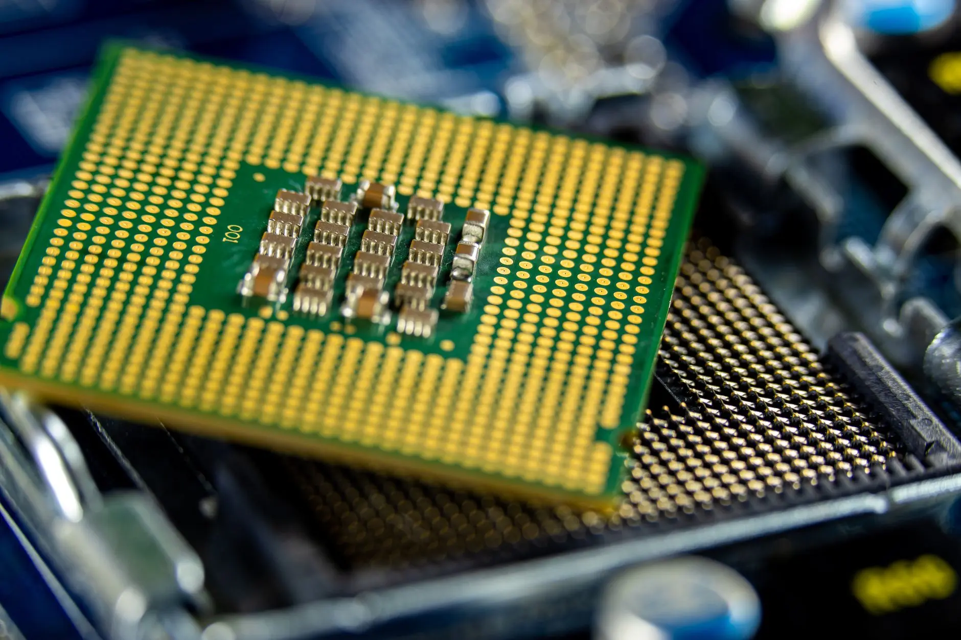 Close-up of a glowing microchip processor with intricate patterns.