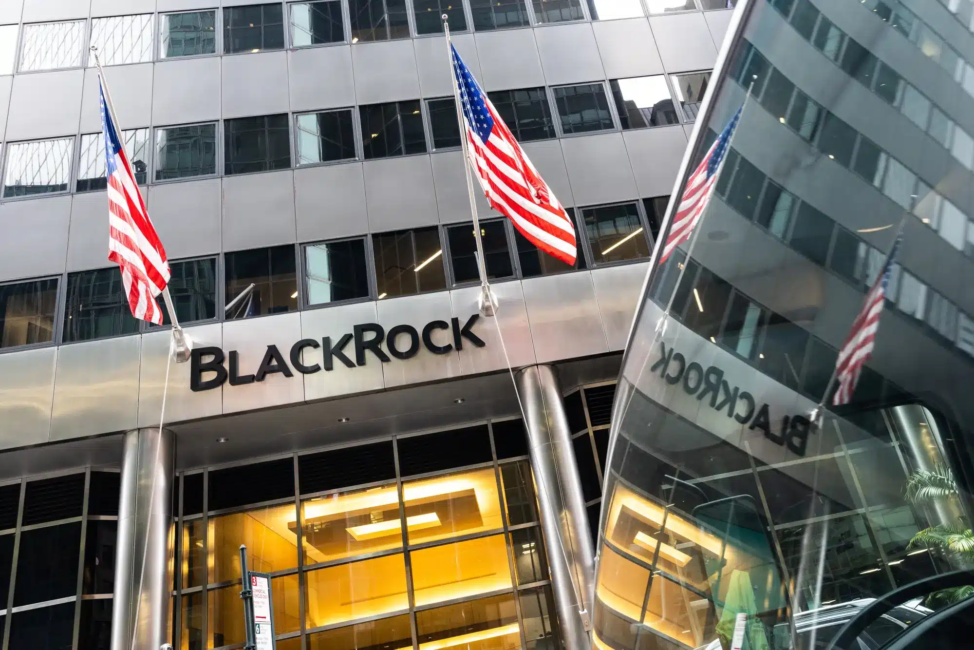 BlackRock headquarters in New York with American flags displayed.